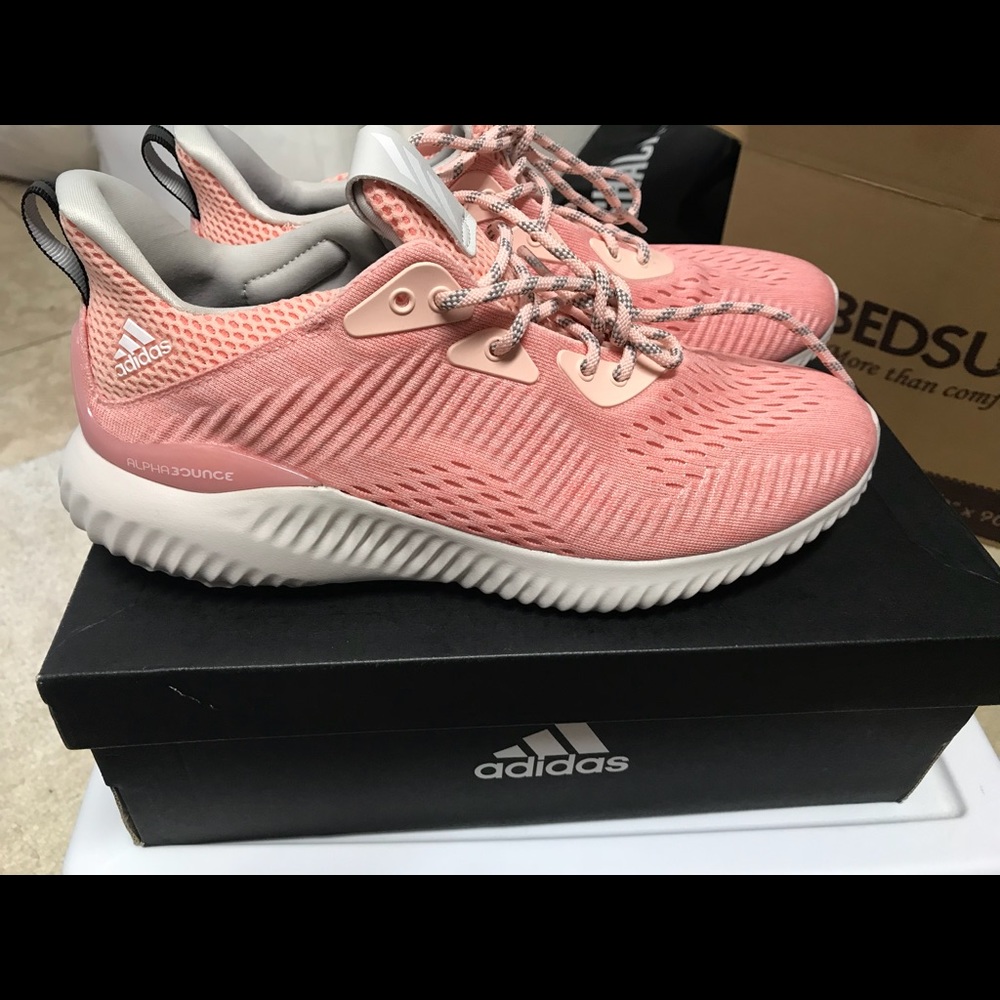 Pink adidas running shoes